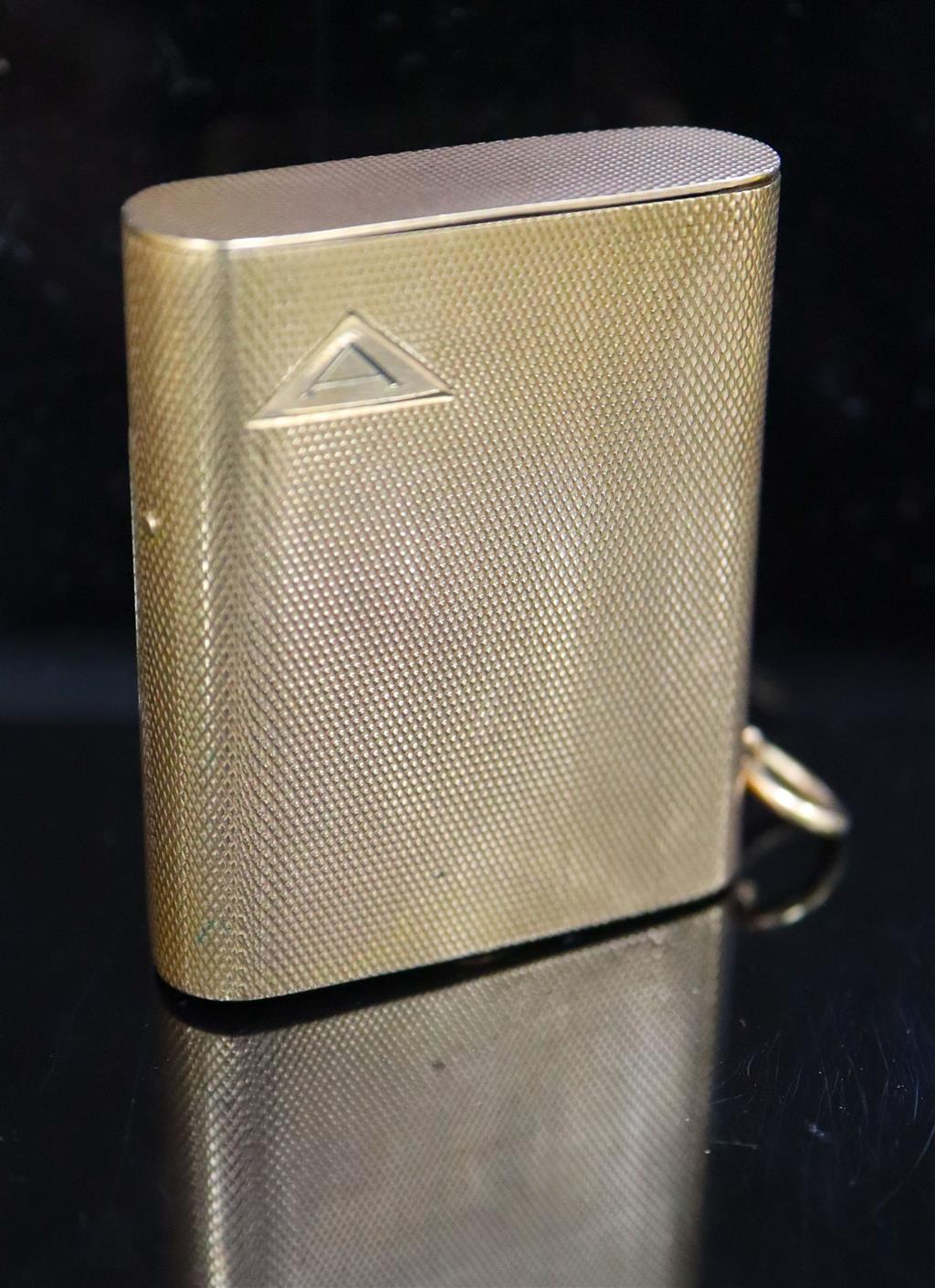 A 1920s engined turned 9ct gold mounted Dunhill lighter, by Finnigans Ltd, London, 1928,